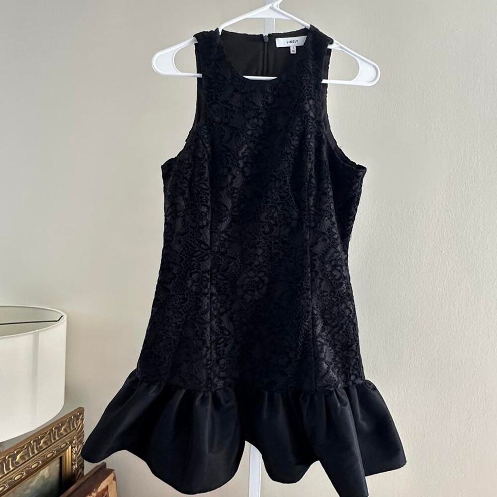 Likely black lace dress with